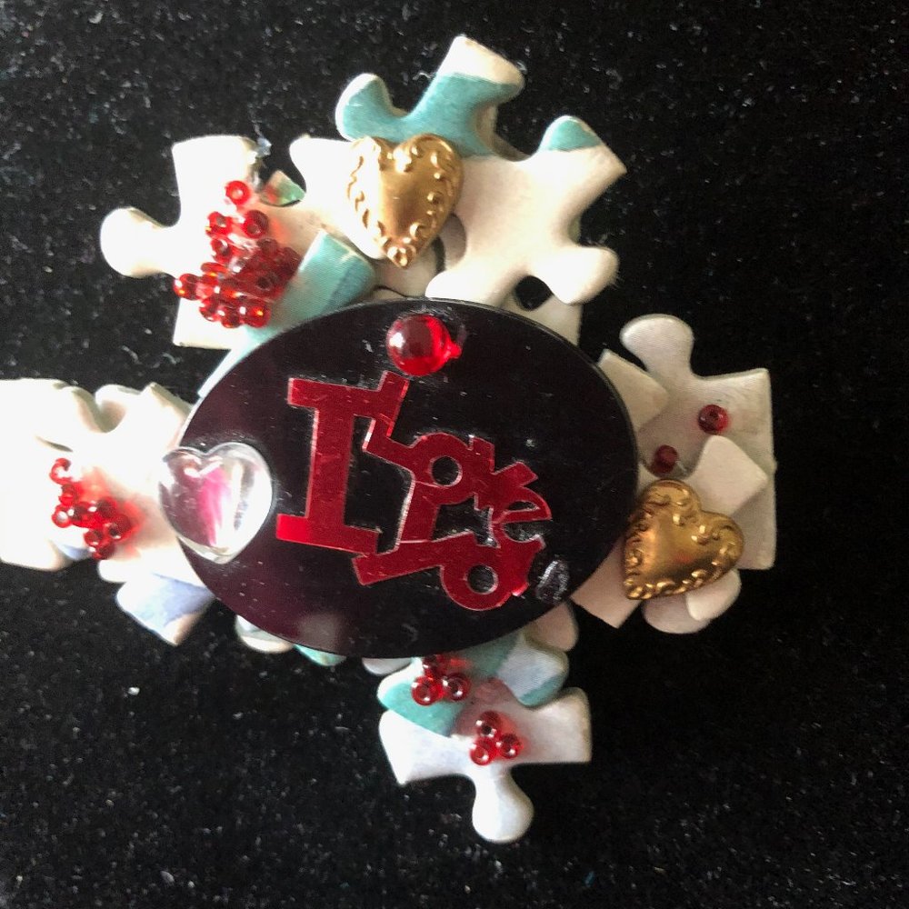 Whimsical handmade "love" pin